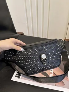 Punk style black faux leather waist bag with silver studs and crystal-eyed skull.