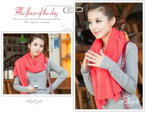 Red orange knitted scarf for autumn and winter warmth, shown on Asian female model