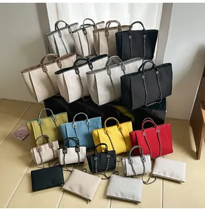 Detailed view of assorted chain tote bags in various vibrant colors and sizes