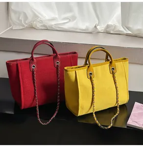 Red and yellow large capacity fabric tote bags with chain straps and top handles