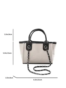 Stylish woven canvas tote bag with metal chain strap and handles, showing dimensions