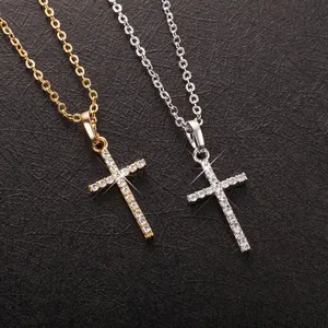 Elegant gold and silver cross necklaces featuring sparkling rhinestone pavé jewelry detail