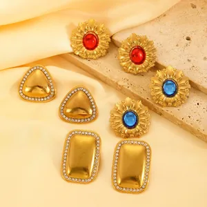 Detailed collection of vintage gold plated stainless steel crystal flower earrings
