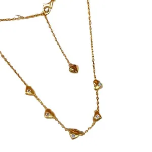Elegant gold plated necklace with five dainty heart pendants and sparkling crystals