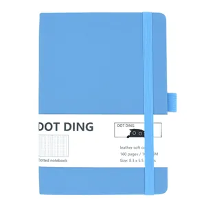 Detail view of blue leather soft cover bullet dotted journal with elastic closure