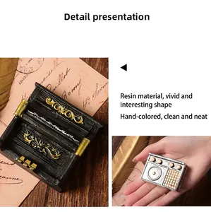 Detailed view of mini retro resin piano and radio ornaments for vintage home decor