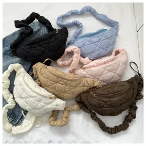 Detail view of multi-color quilted crossbody bags featuring unique scrunchie straps