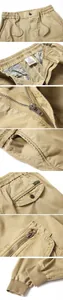 Details of khaki cargo joggers featuring drawstring waist, zipper fly, and pockets.