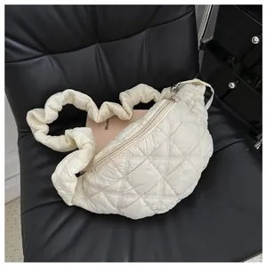 Detailed macro shot of off-white quilted puffer chest bag featuring a unique ruffled strap
