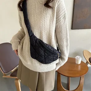 Stylish black quilted crossbody chest bag for autumn and winter fashion.