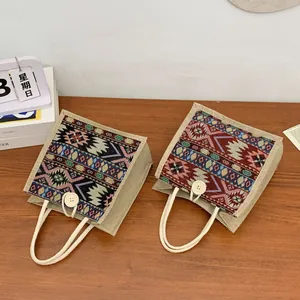 Detailed view of ethnic style woven tote bags featuring colorful geometric patterns