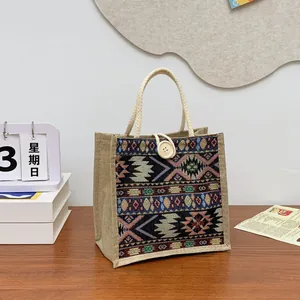 Close-up of ethnic style woven tote bag featuring tribal patterns and rope handles