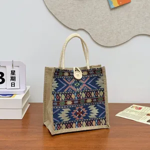 Ethnic style woven tote bag featuring colorful tribal patterns and rope handles