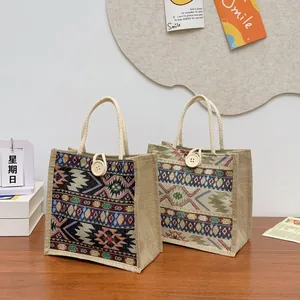 Detail of ethnic style woven tote bags with bohemian patterns and rope handles