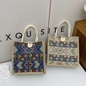 Close-up of two ethnic style woven tote bags with colorful bohemian patterns