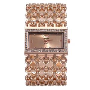 Elegant rose gold women's quartz watch with wide rhinestone encrusted bracelet strap.