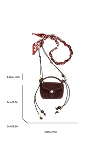 Detailed view of vintage suede mini crossbody coin purse with 10x7x3cm dimensions