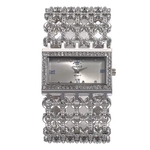 Detailed view of luxury silver women's rectangular quartz watch with full rhinestone strap