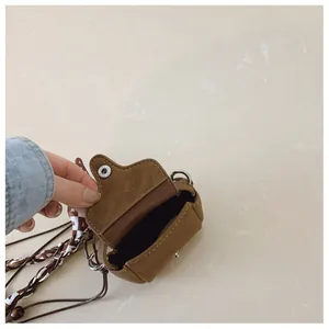 Close-up interior view showing the suede texture of a vintage mini brown crossbody coin purse