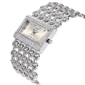 Detailed view of women's square quartz watch with full rhinestone mesh bracelet