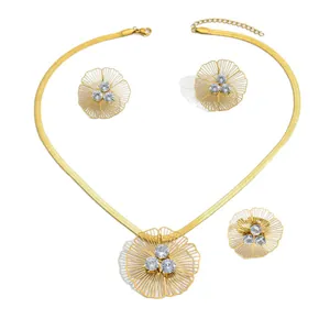Gold-plated filigree flower jewelry set with necklace, earrings, and ring with zircons.