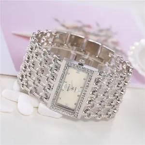 Luxury silver quartz watch with wide rhinestone bracelet band and rectangular dial