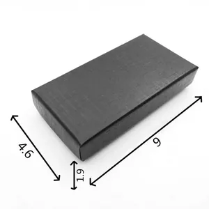 Detailed macro view of black textured gift box with specific dimensions 9x4.6x1.9 units