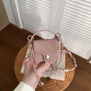 Vintage mini pink suede crossbody coin purse featuring silver snap button and bead accents