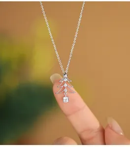 Close-up of S925 silver hollow Christmas tree necklace with sparkling zircons