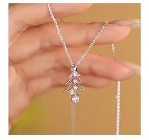 Close-up detail of S925 sterling silver Christmas tree necklace with sparkling zircons
