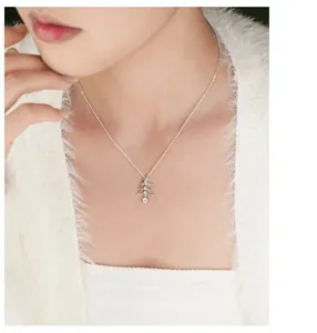 Close-up of S925 silver hollow Christmas tree pendant necklace with zircons