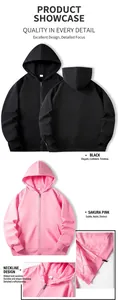 Detailed view of pink and black zip-up hoodies with ribbed collar and quality zipper.