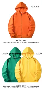 Detailed display of vibrant solid color unisex zip-up hoodies in orange, green, and yellow