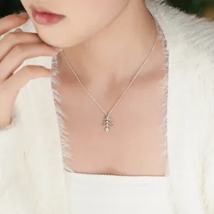 S925 sterling silver Christmas tree pendant necklace with sparkling zircons on model.