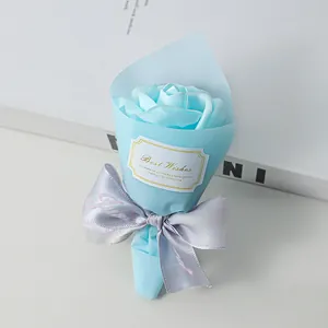 Close-up of a mini light blue soap rose bouquet with Best Wishes tag and ribbon