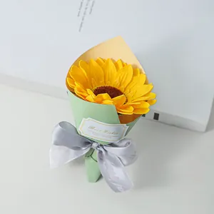 Detailed view of mini sunflower soap flower bouquet with a grey ribbon and Best Wishes tag