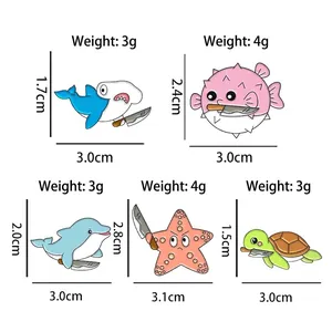 Detailed cartoon marine animal enamel pin set featuring shark and turtle designs