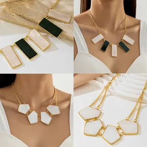 Detail of European style statement necklace with green and white marble resin pendants