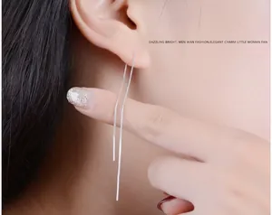 Detailed shot of S925 sterling silver long tassel ear thread earrings on model