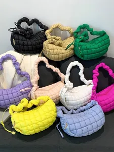Set of colorful quilted puffer dumpling bags with pleated straps for versatile styling