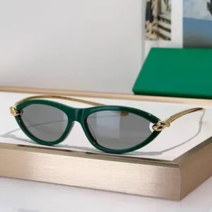 Fashionable green oval sunglasses with elegant gold metal temples for outdoor protection