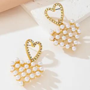 Elegant gold-plated heart drop earrings with white pearls and sparkling rhinestones