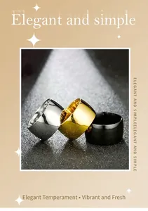 Close-up detail of wide plain surface fashion rings in silver, gold, and black