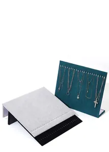Velvet jewelry display stand for necklaces and earrings in teal and grey tones