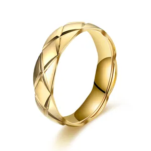 Macro view of a gold-plated stainless steel ring featuring a classic quilted pattern texture