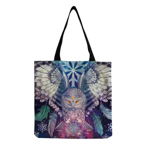 Detailed view of portable tote bag with artistic owl and starry sky print design.