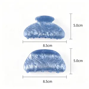 Detail view with dimensions of blue acrylic water-pattern hair claw clips