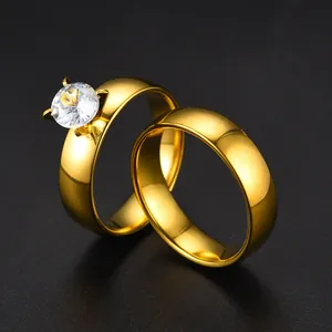 High-quality close-up of gold-plated stainless steel couple ring set with CZ stone