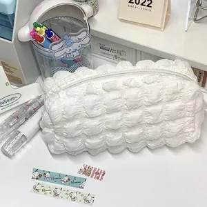 Detailed macro shot of the cream puff quilted texture on a large white pencil case