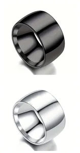 Detailed view of polished wide plain alloy rings in sleek black and silver finishes